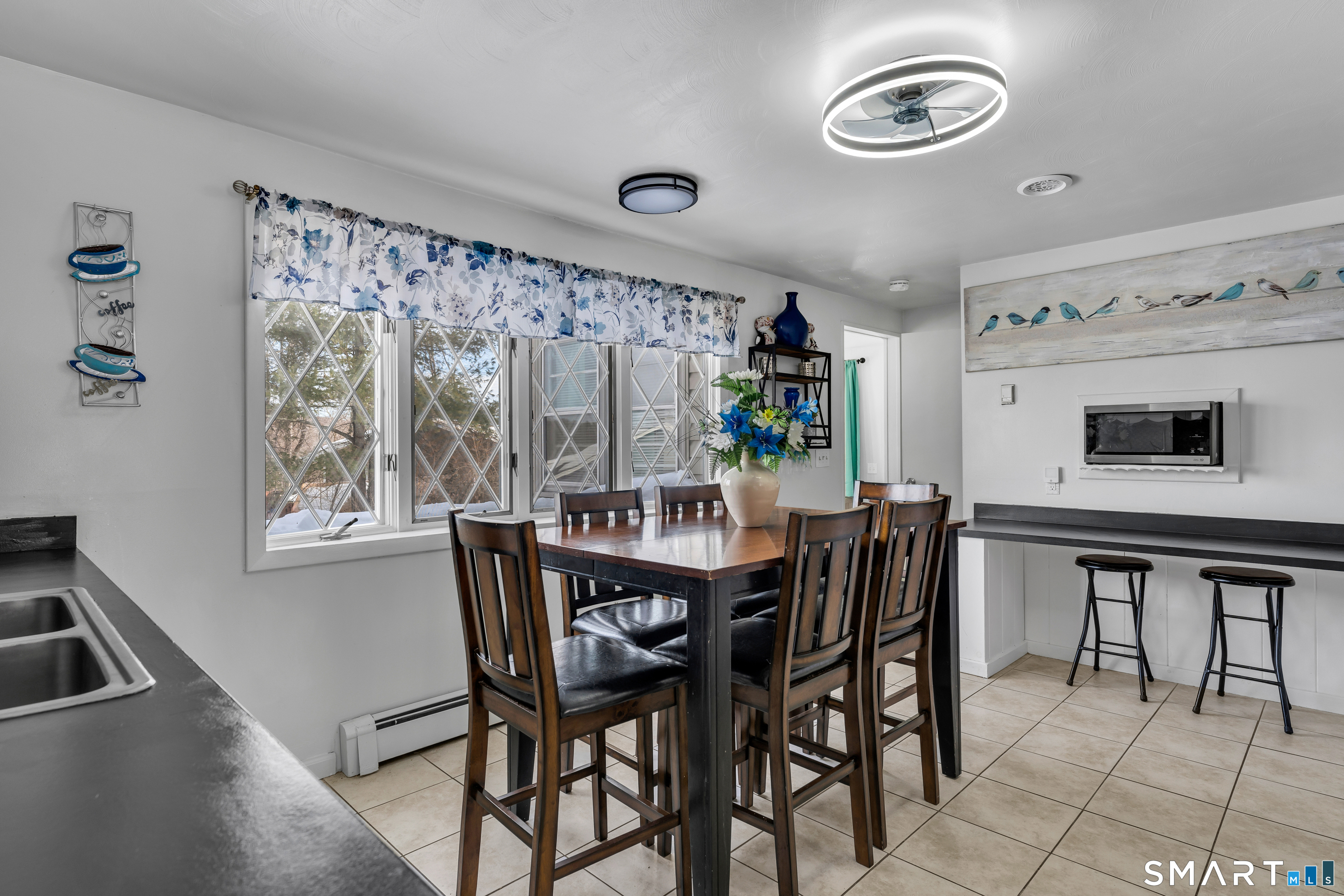 3 Hilltop Drive Ledyard, CT 06339 - Photo 11 of 34 a view of a dining room with furniture and window