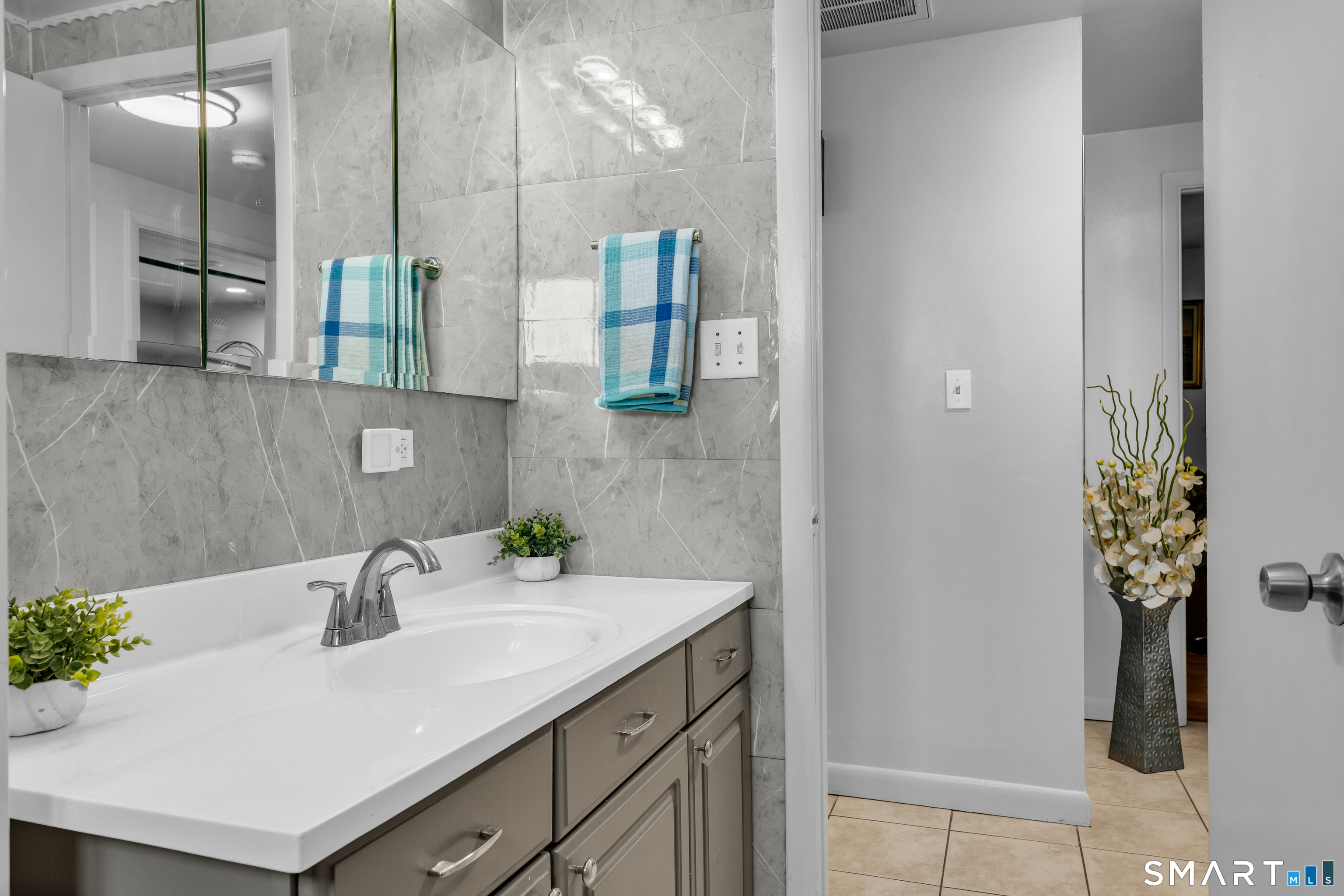 3 Hilltop Drive Ledyard, CT 06339 - Photo 15 of 34 a bathroom with a sink and a mirror