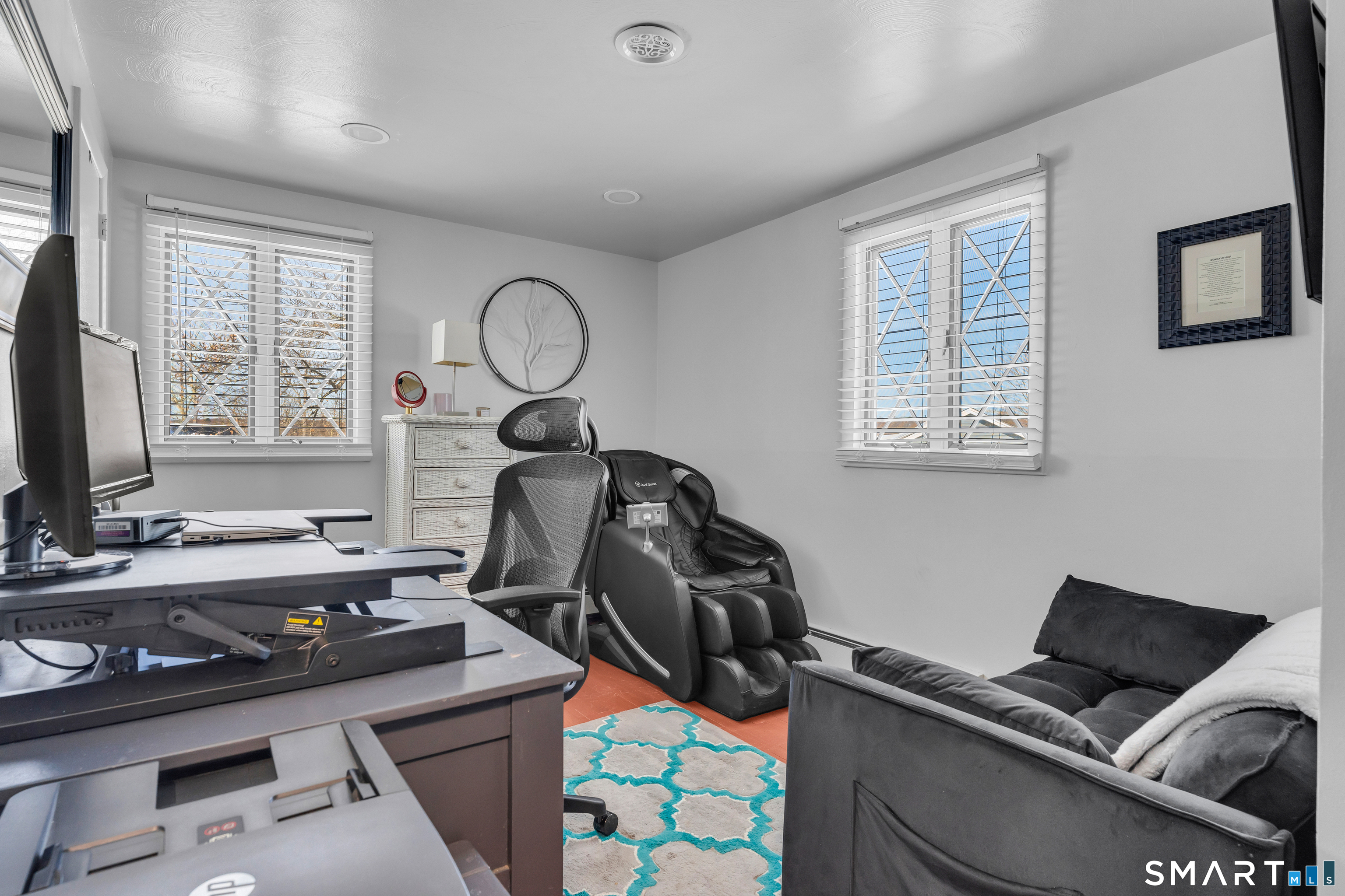 3 Hilltop Drive Ledyard, CT 06339 - Photo 20 of 34 a room with furniture a flat screen tv and a window