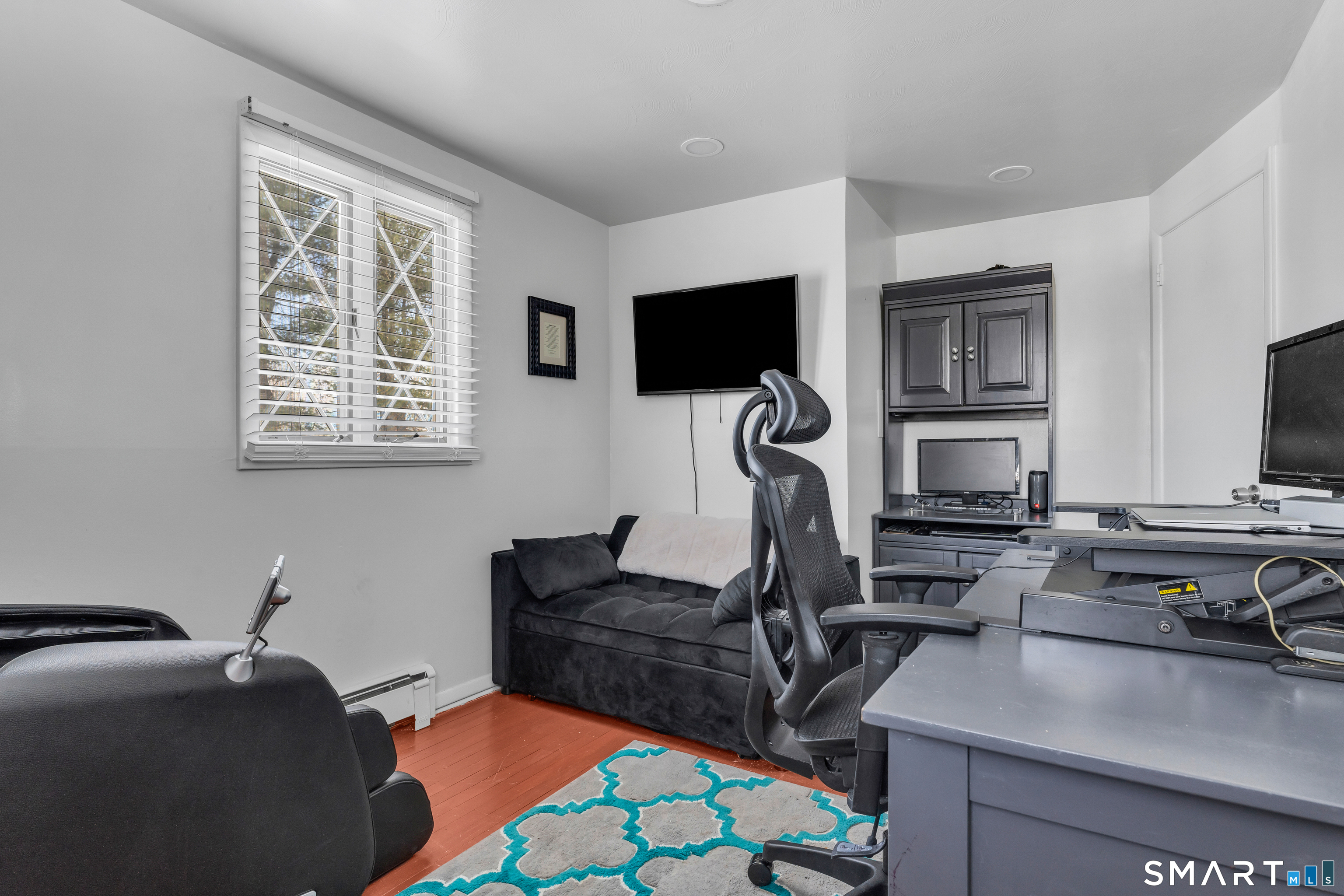 3 Hilltop Drive Ledyard, CT 06339 - Photo 21 of 34 a bedroom with furniture and a flat screen tv