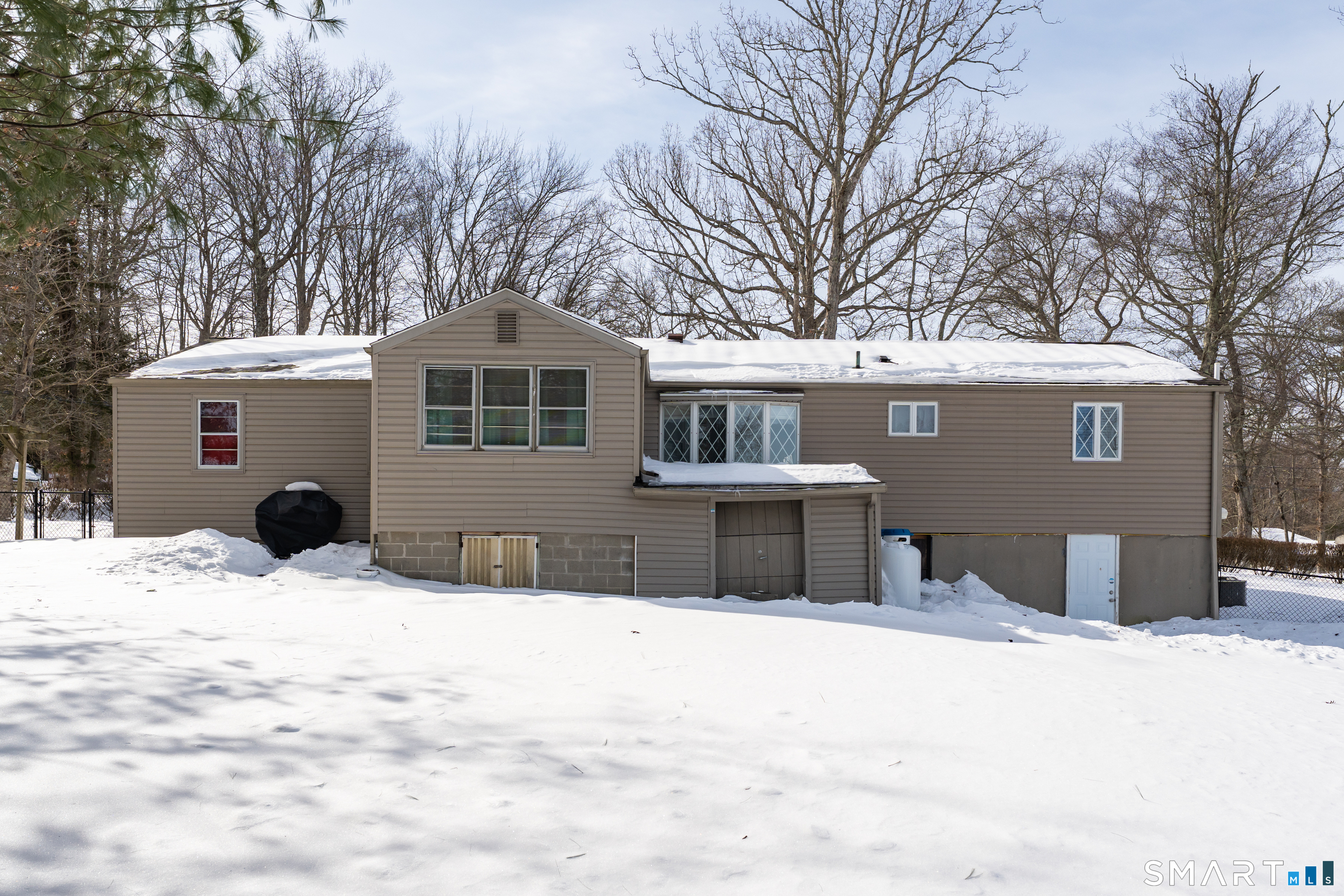 3 Hilltop Drive Ledyard, CT 06339 - Photo 29 of 34 a front view of a house with a yard covered in snow