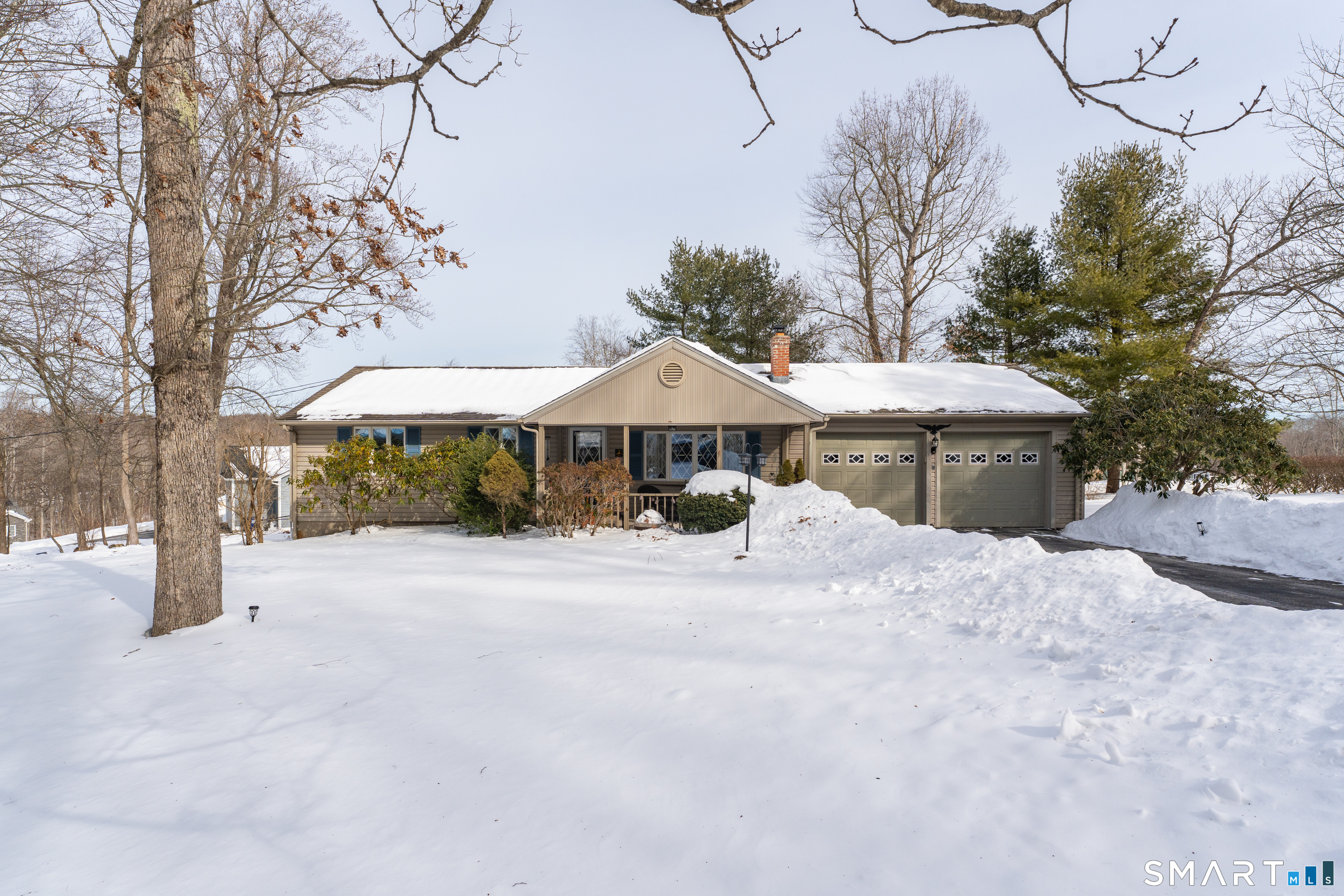 3 Hilltop Drive Ledyard, CT 06339 - Photo 4 of 34 a front view of a house with yard and parking space