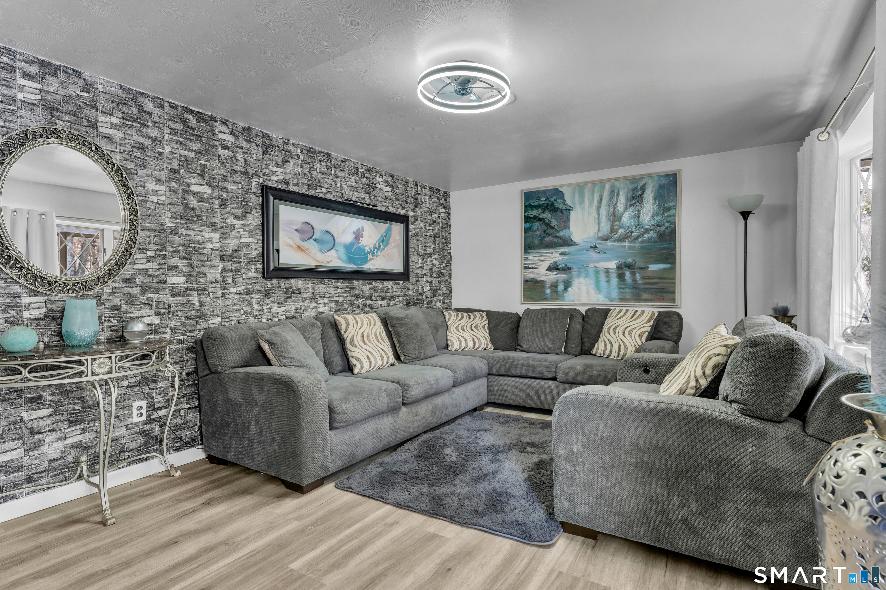 3 Hilltop Drive Ledyard, CT 06339 - Photo 6 of 34 a living room with furniture and a large window