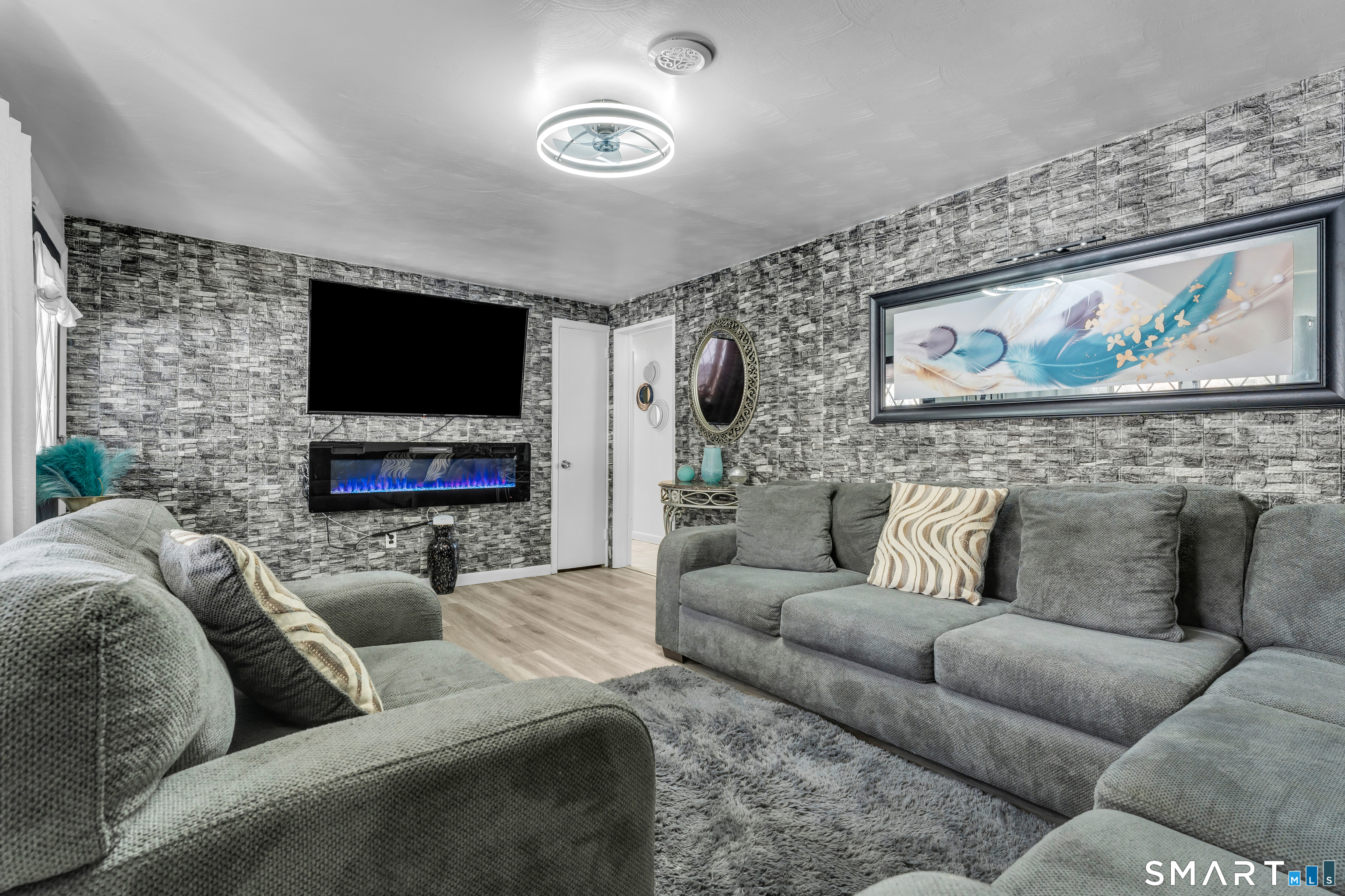 3 Hilltop Drive Ledyard, CT 06339 - Photo 9 of 34 a living room with furniture and a flat screen tv