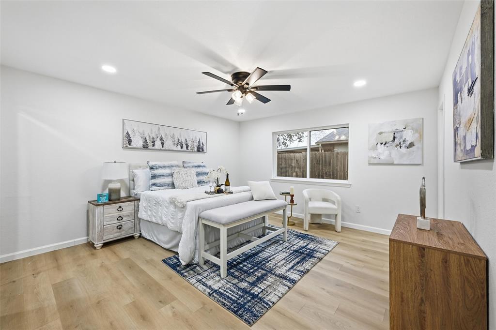 4840 Graham Court The Colony, TX 75056 - Photo 12 of 23 a view of a bedroom with furniture window and wooden floor