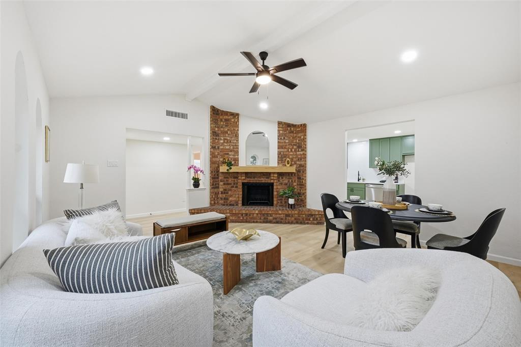 4840 Graham Court The Colony, TX 75056 - Photo 4 of 23 a living room with furniture and a fireplace