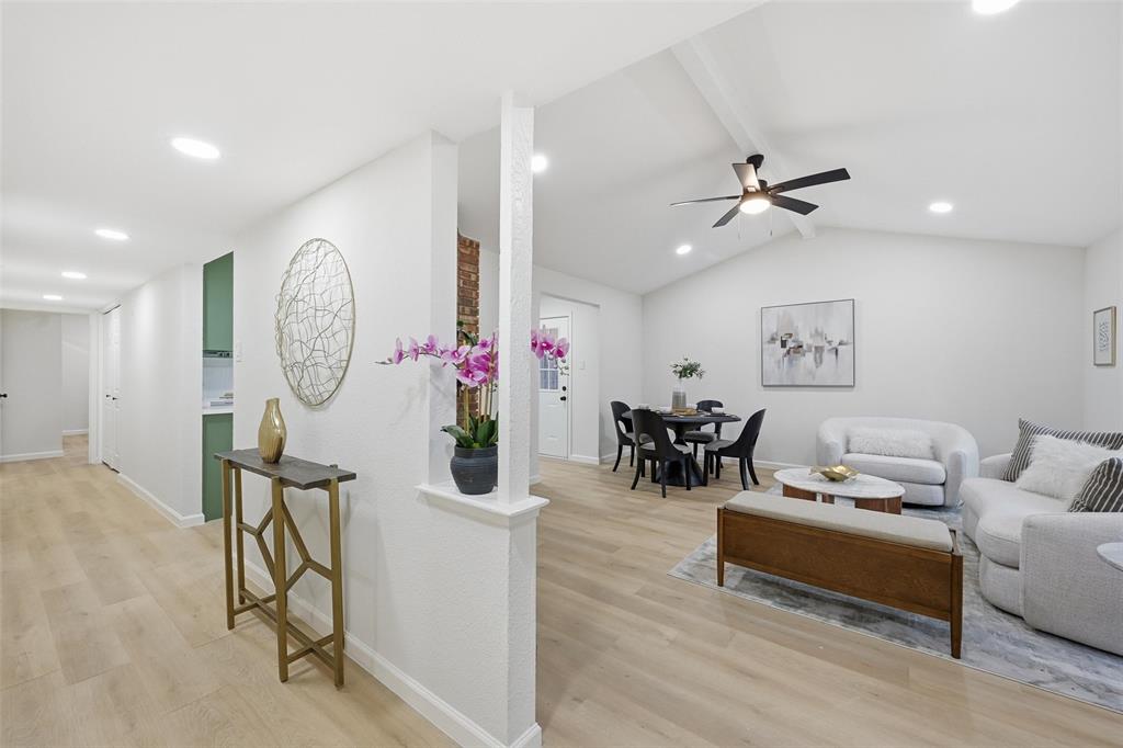 4840 Graham Court The Colony, TX 75056 - Photo 5 of 23 a living room with furniture a window and a chandelier