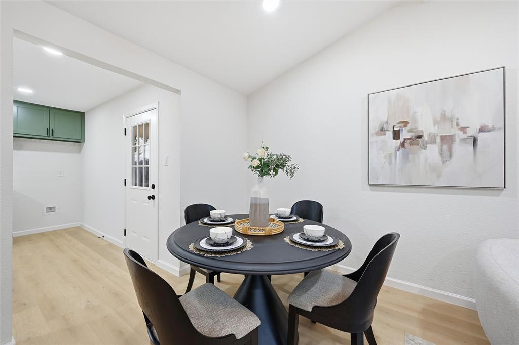 4840 Graham Court The Colony, TX 75056 - Photo 8 of 23 a view of a dining room with furniture and wooden floor