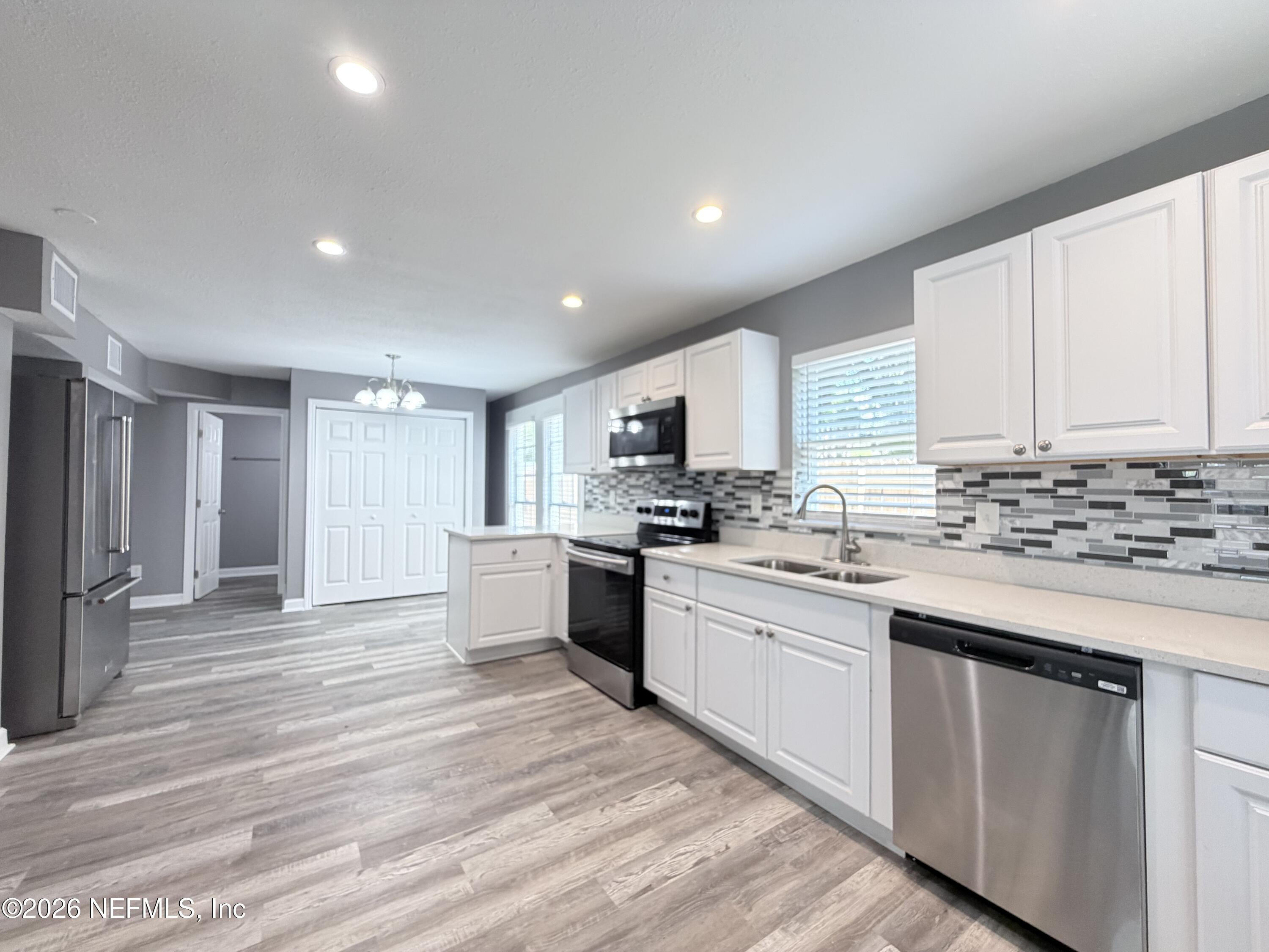 5336 Cruz Road Jacksonville, FL 32207 - Photo 8 of 29 a large kitchen with cabinets