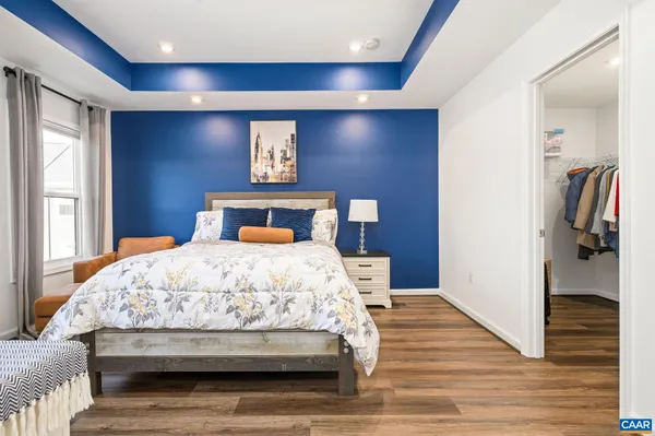 a bedroom with a bed and a view of bathroom