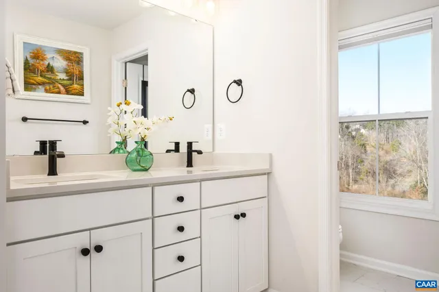 swimming pool view with a seating space