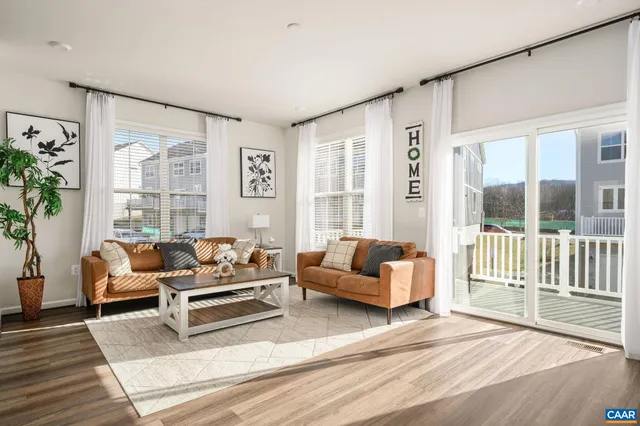 a bathroom with a sink a toilet and a window