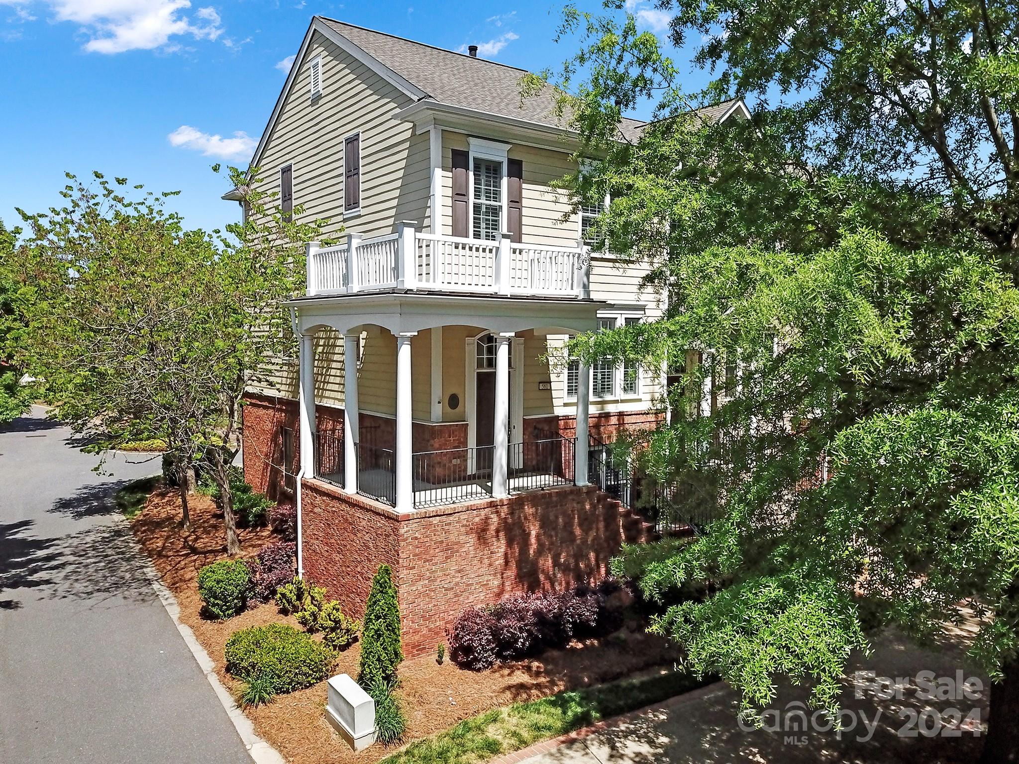 front view of a house with a garden