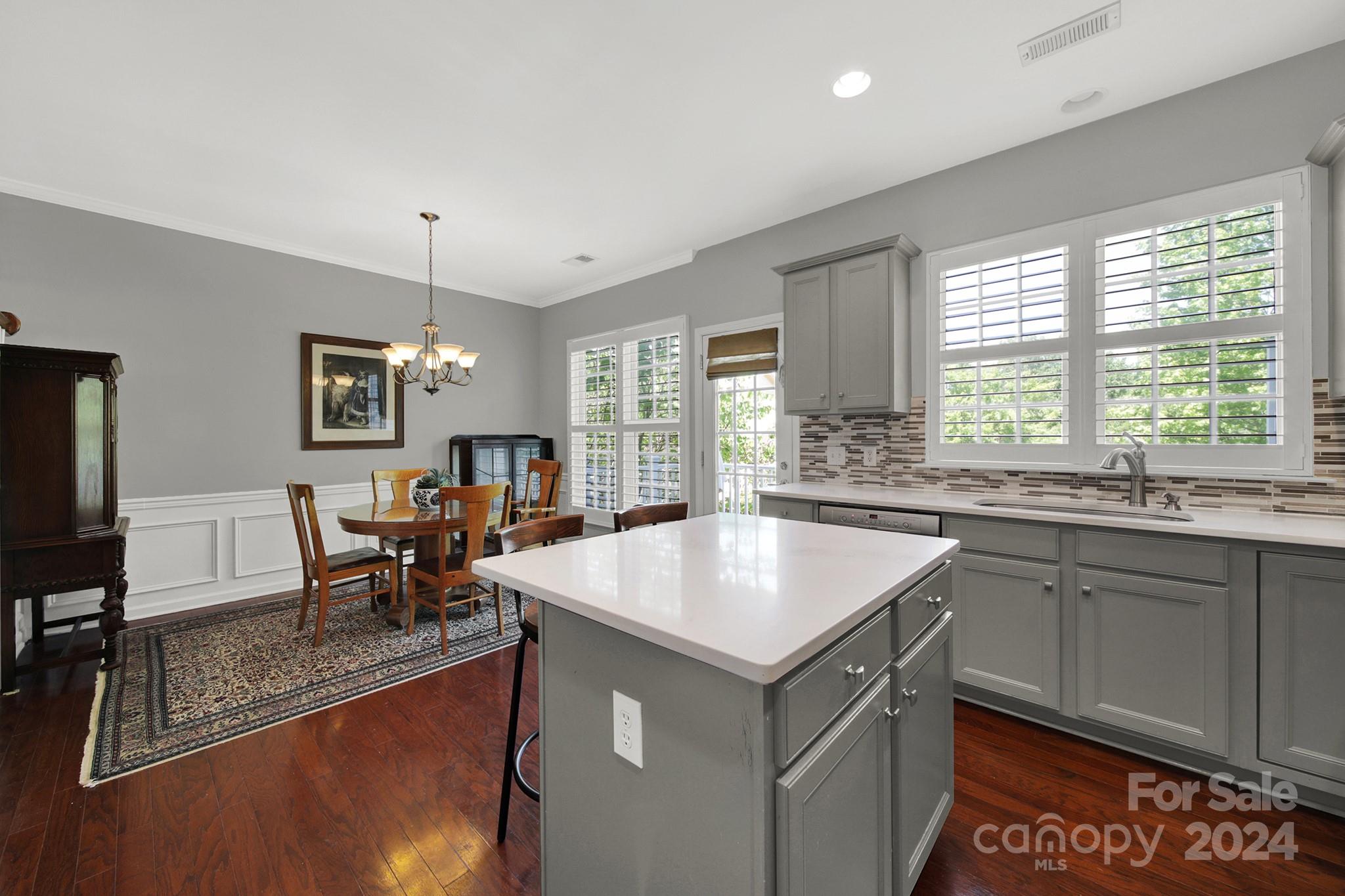 581 6th Baxter Crossing Fort Mill, SC 29708 - Photo 11 of 30 a kitchen with a sink a counter top space and stainless steel appliances