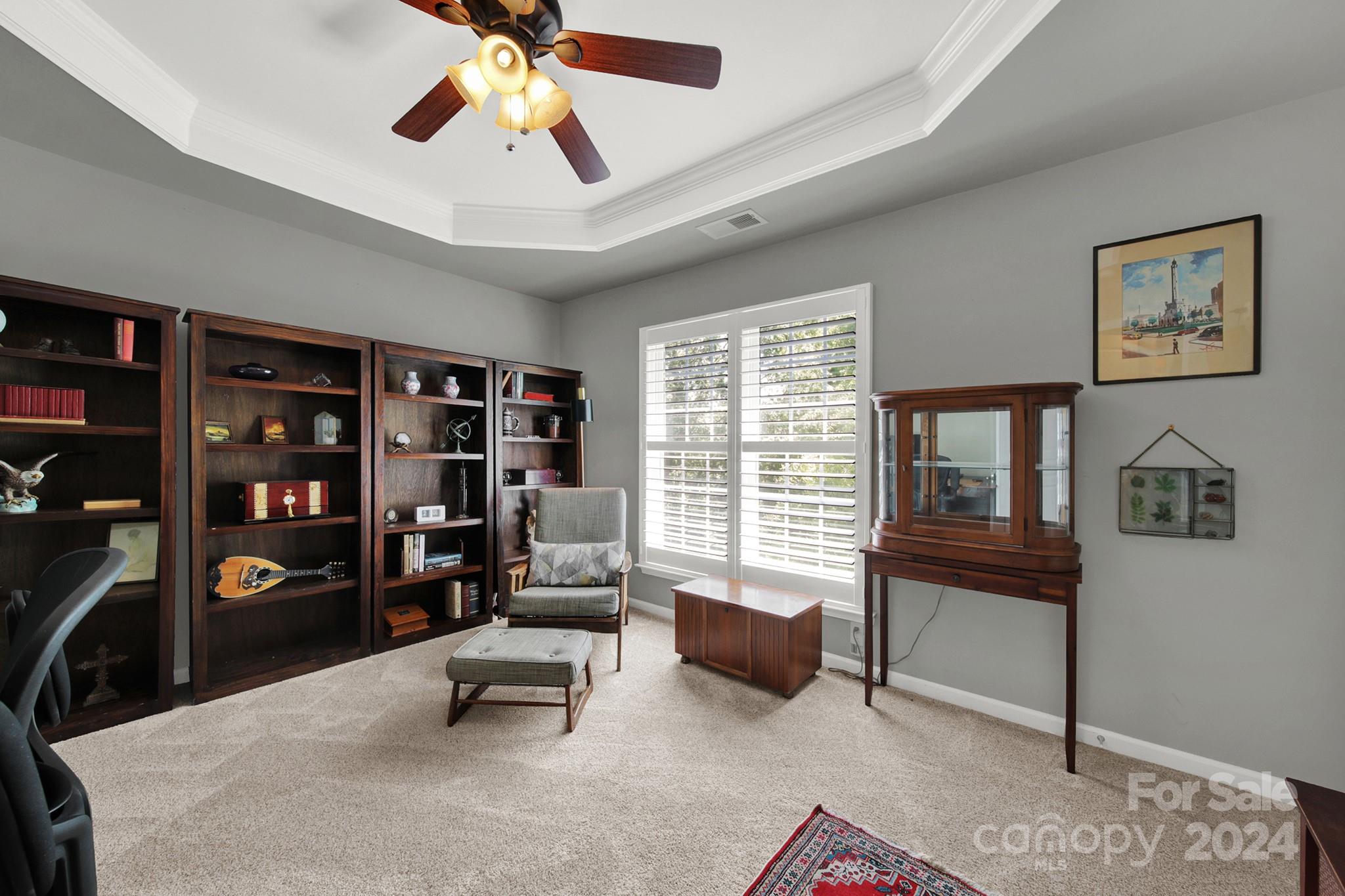 581 6th Baxter Crossing Fort Mill, SC 29708 - Photo 14 of 30 a bedroom with furniture and a book shelf