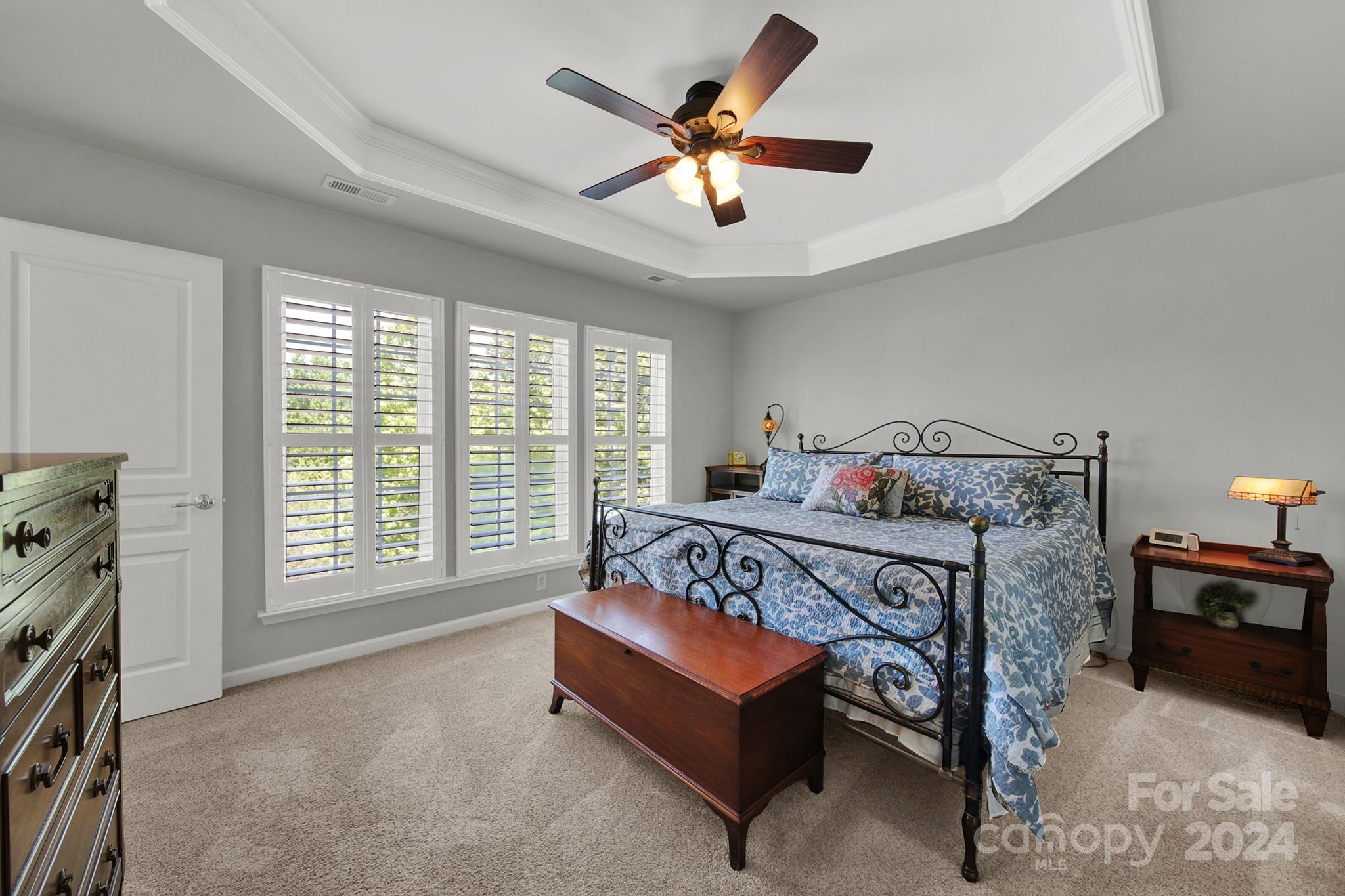 581 6th Baxter Crossing Fort Mill, SC 29708 - Photo 18 of 30 a white bed sitting in a room next to a window