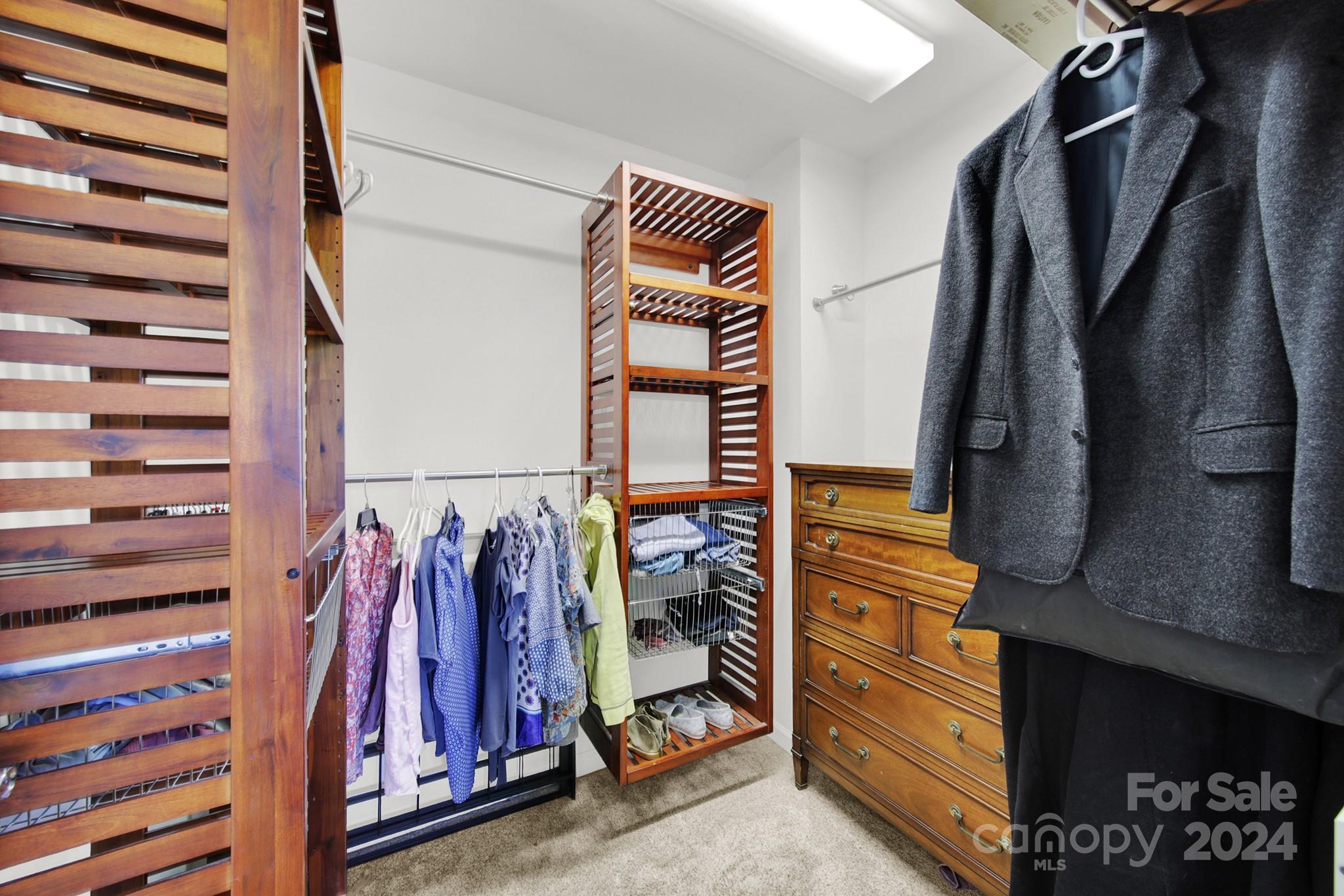581 6th Baxter Crossing Fort Mill, SC 29708 - Photo 21 of 30 a view of walk in closet with clothes and shoes
