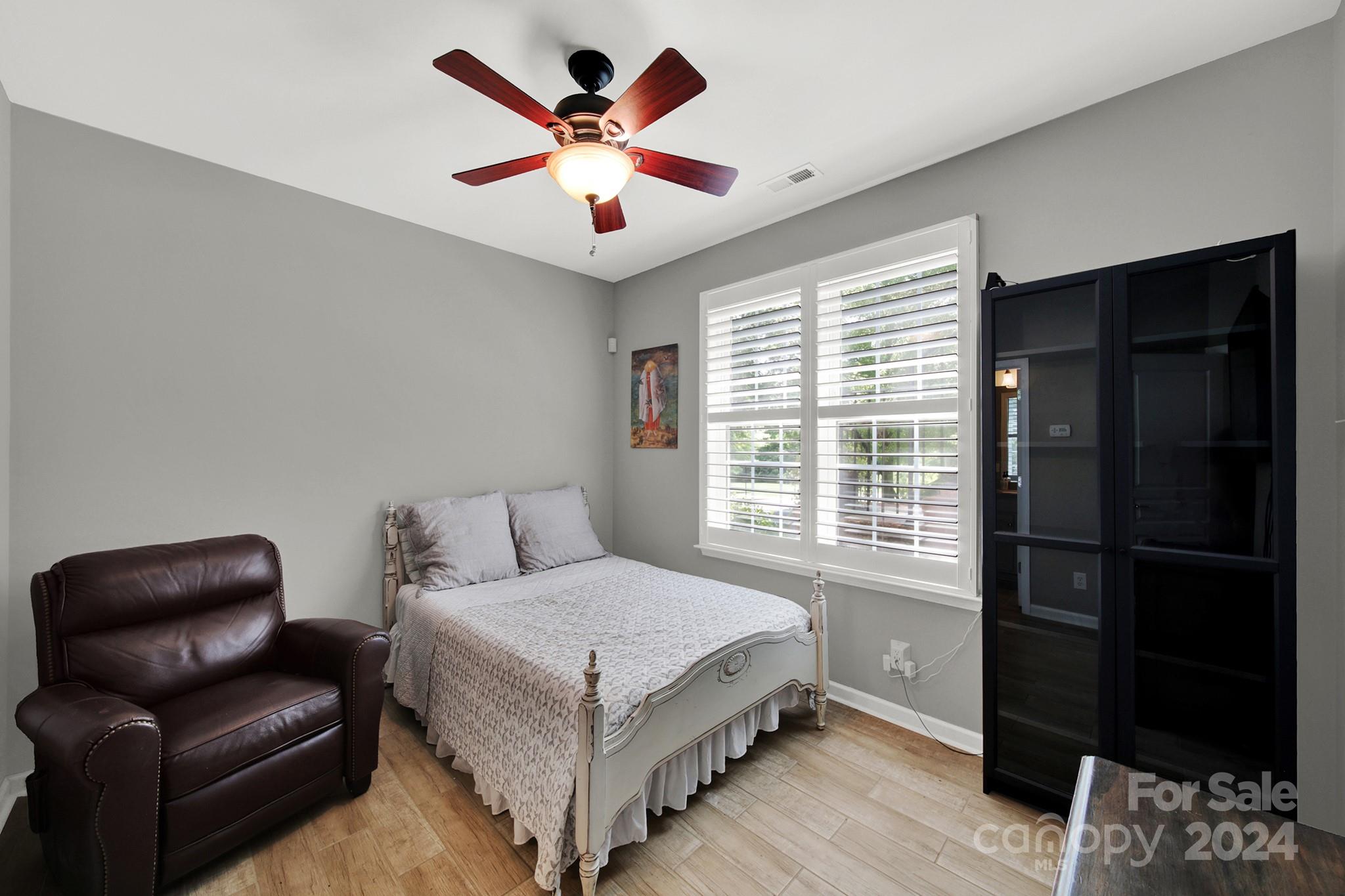 581 6th Baxter Crossing Fort Mill, SC 29708 - Photo 23 of 30 a bedroom with a bed couch and a window