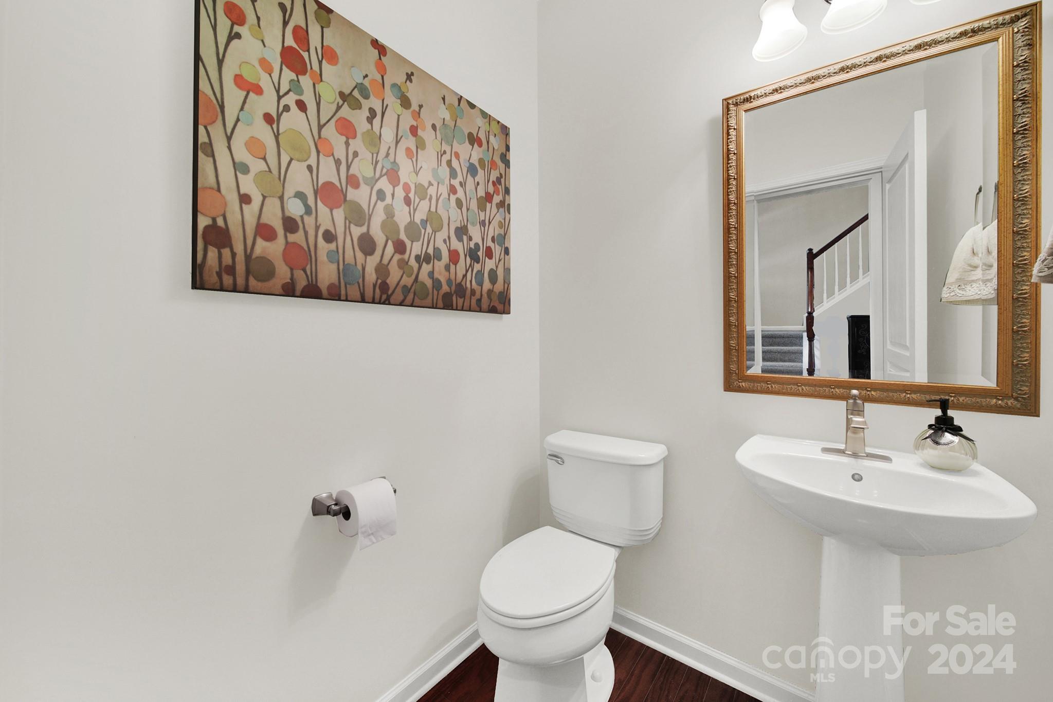 581 6th Baxter Crossing Fort Mill, SC 29708 - Photo 26 of 30 a bathroom with a toilet sink and a mirror