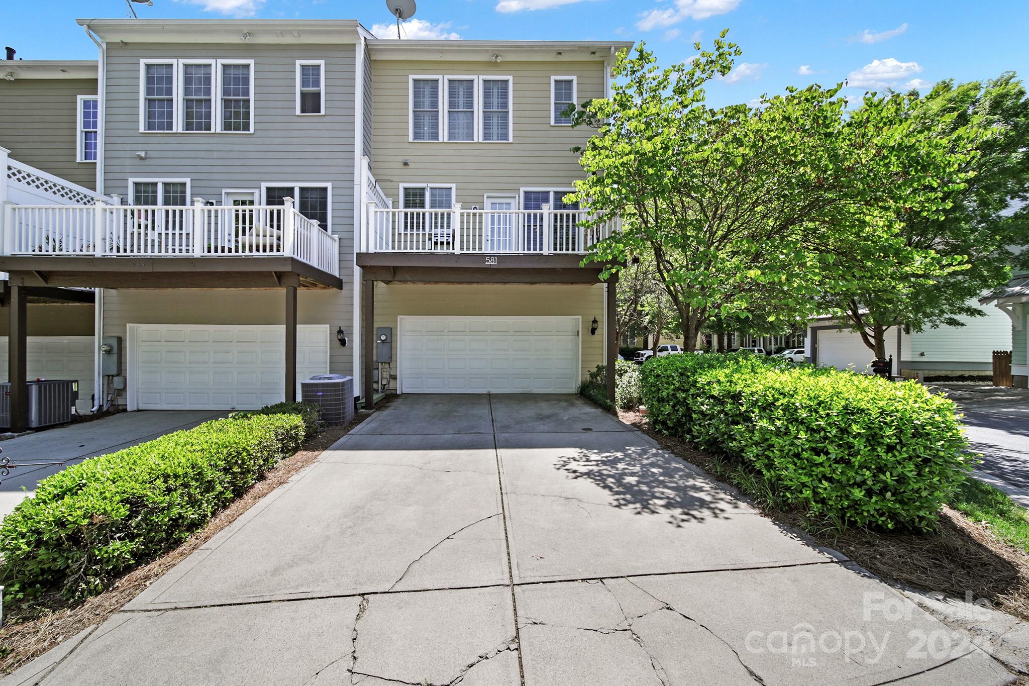 581 6th Baxter Crossing Fort Mill, SC 29708 - Photo 29 of 30 a front view of a house with a garden