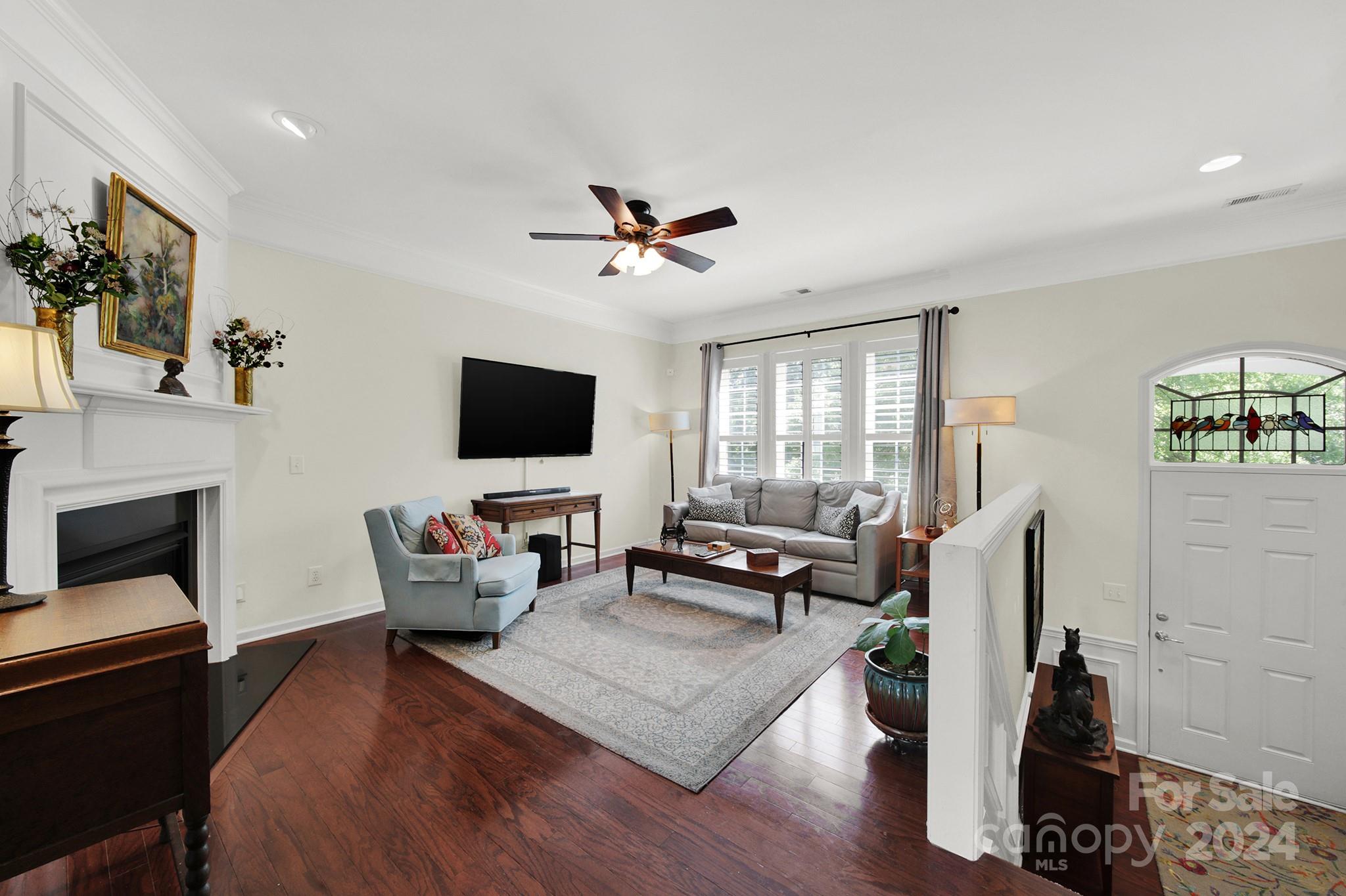 581 6th Baxter Crossing Fort Mill, SC 29708 - Photo 5 of 30 a living room with furniture and a flat screen tv