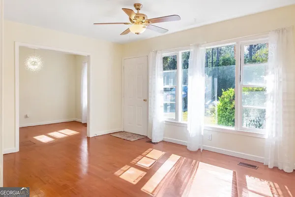 a view of an empty room with a window