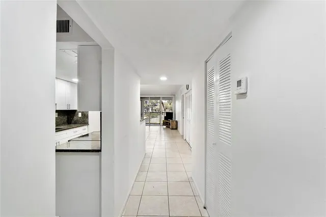 a view of a hallway with a living room
