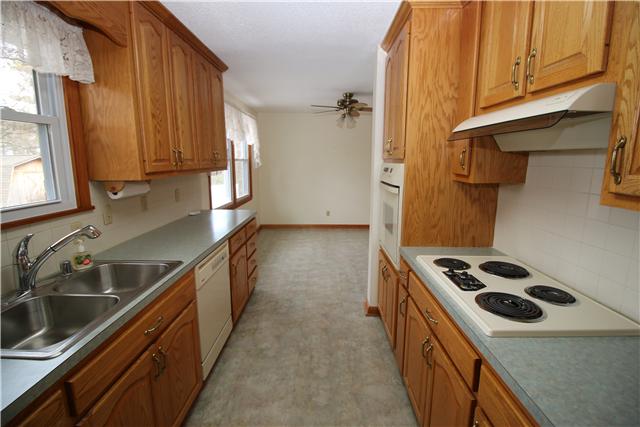 2808 Brett Road Northwest Huntsville, AL 35810 - Photo 8 of 20 a kitchen with a stove and a sink