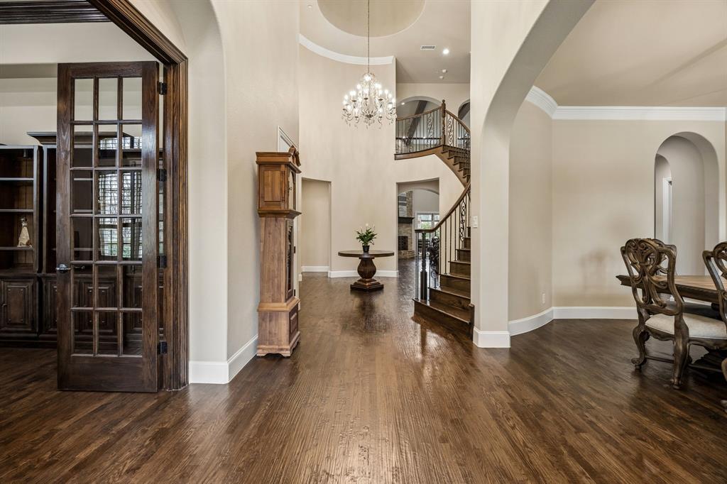 1005 Berkshire Road Southlake, TX 76092 - Photo 5 of 40 a view of a hallway with wooden floor and staircase