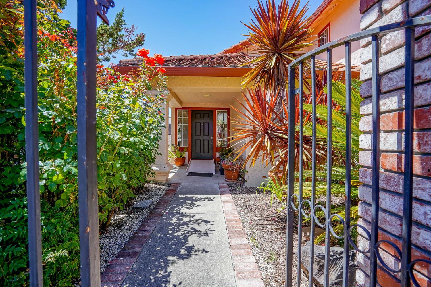 a front view of a multi story residential apartment building with a yard