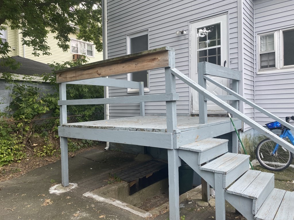 19 Meacham Street, Unit 1 Somerville, MA 02145 - Photo 11 of 11 a balcony with table and chairs