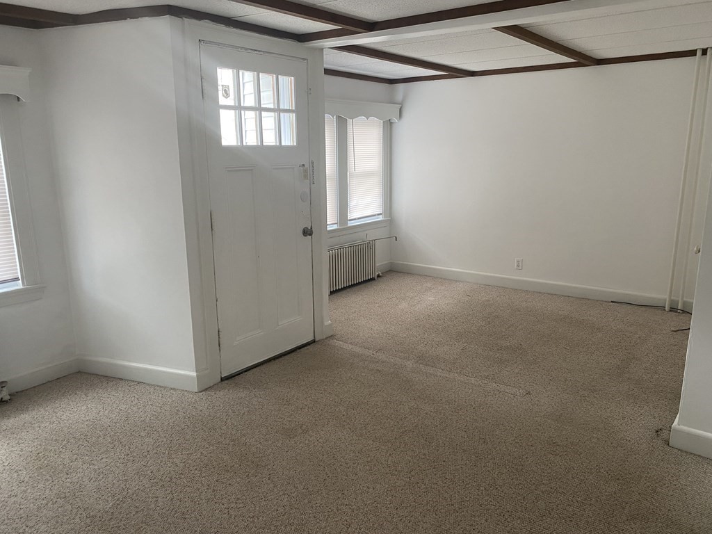 19 Meacham Street, Unit 1 Somerville, MA 02145 - Photo 3 of 11 a view of a livingroom with a window