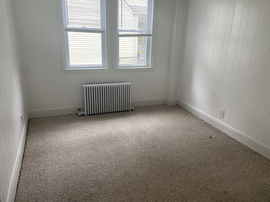 19 Meacham Street, Unit 1 Somerville, MA 02145 - Photo 5 of 11 an empty room with a window