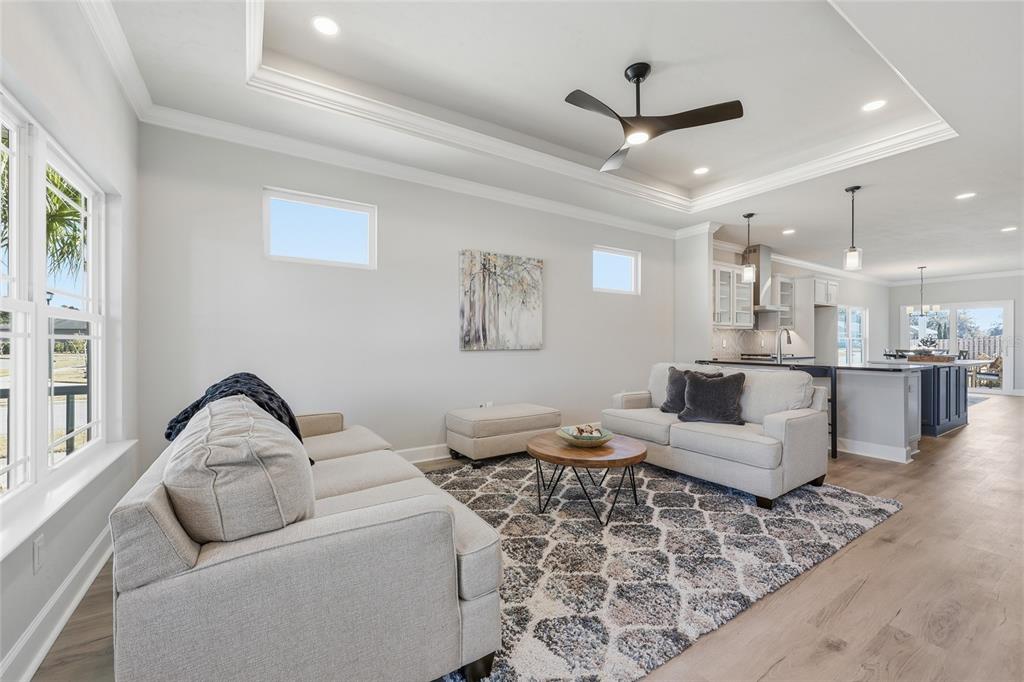 9567 Southwest 66th Lane Gainesville, FL 32608 - Photo 14 of 20 a living room with furniture a ceiling fan and a rug