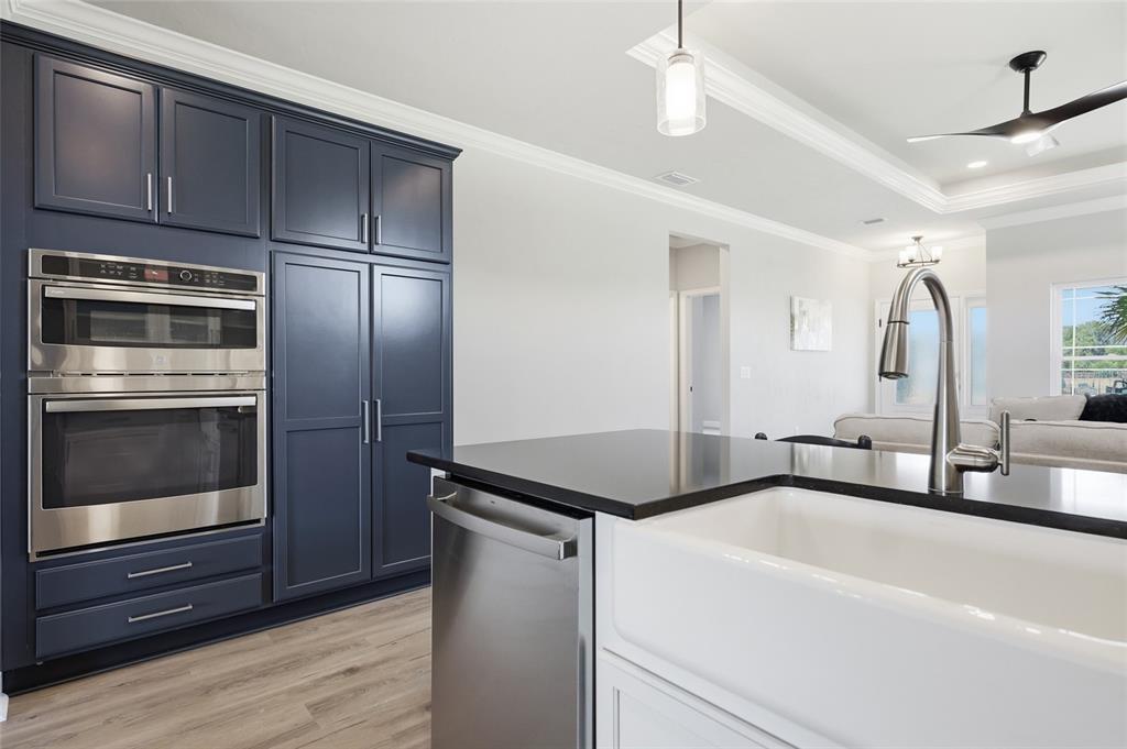 9567 Southwest 66th Lane Gainesville, FL 32608 - Photo 17 of 20 a kitchen with a refrigerator and a sink