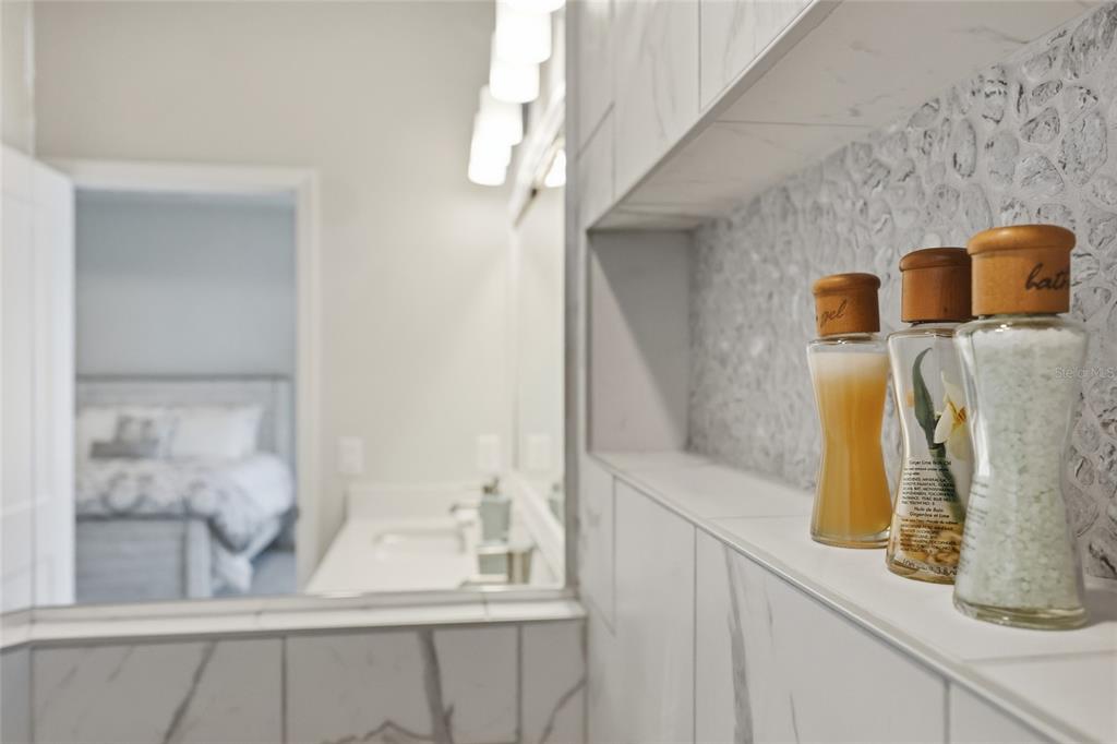 9567 Southwest 66th Lane Gainesville, FL 32608 - Photo 19 of 20 a bathroom with a sink and mirror