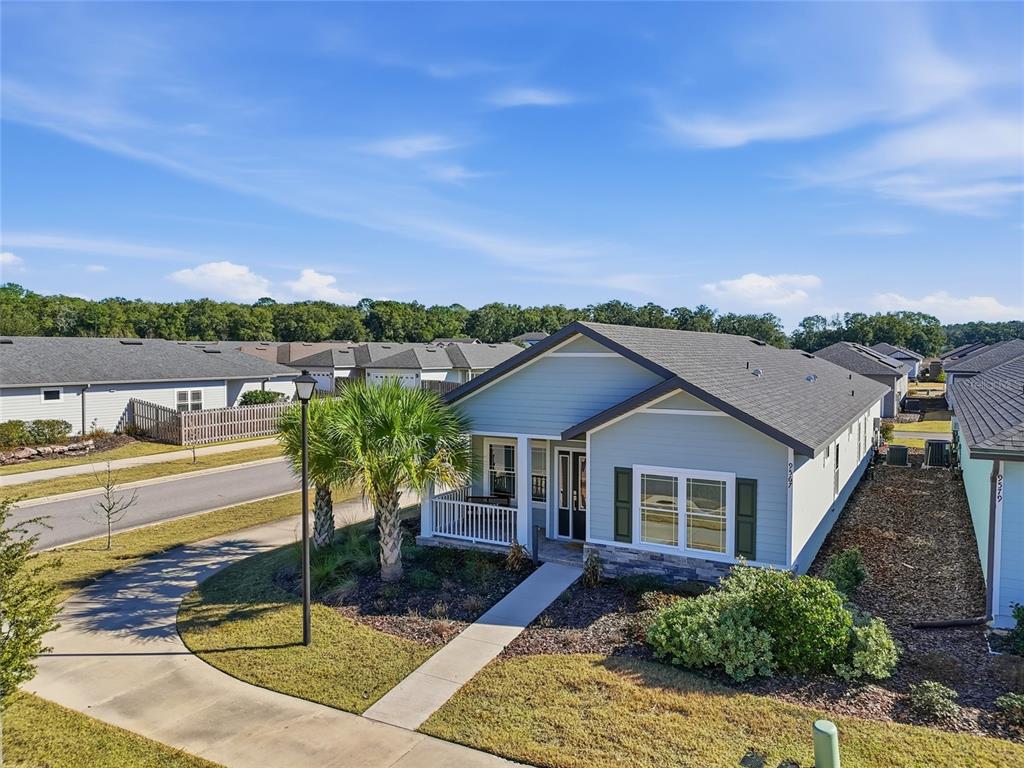 9567 Southwest 66th Lane Gainesville, FL 32608 - Photo 3 of 20 a view of a house with pool and a chairs