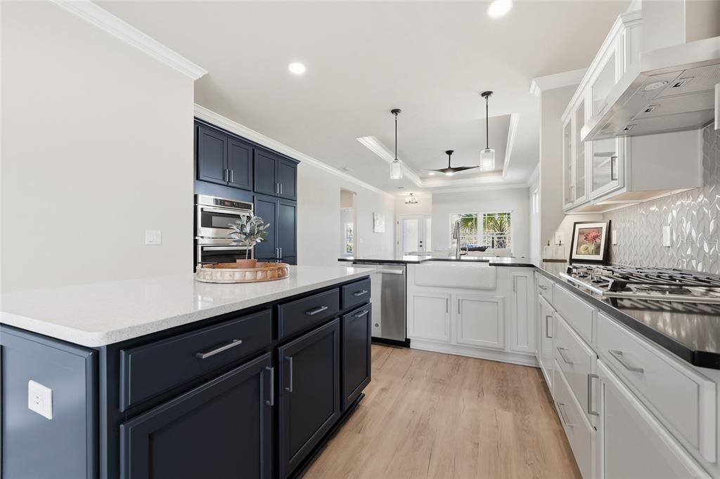 9567 Southwest 66th Lane Gainesville, FL 32608 - Photo 9 of 20 a kitchen with stainless steel appliances granite countertop a sink and cabinets