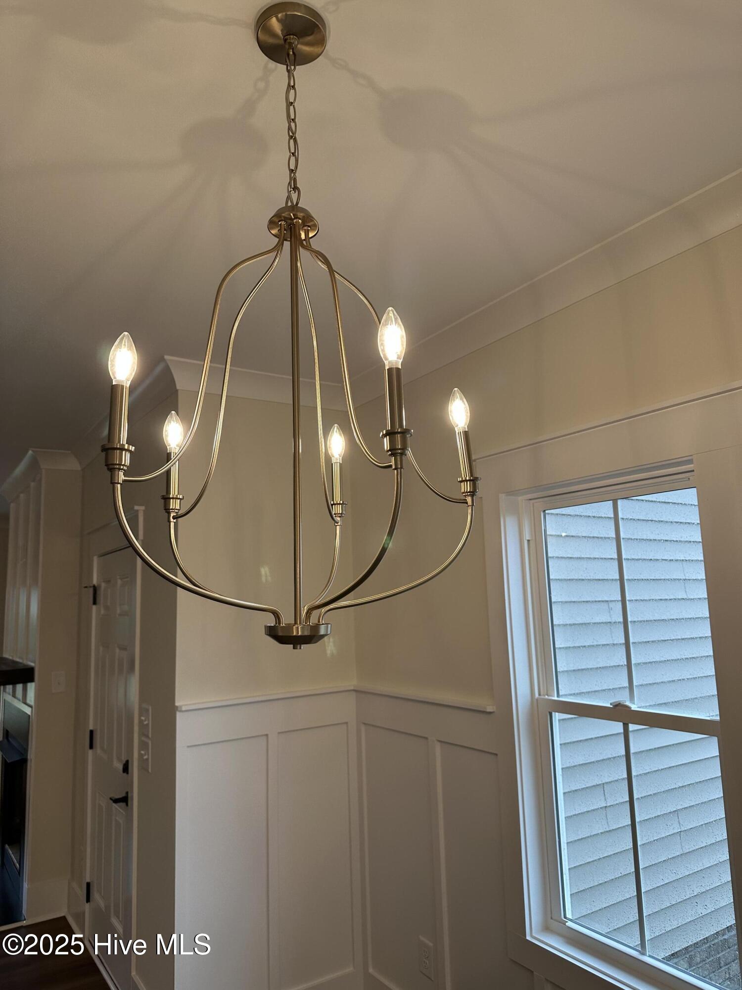 147 Conover Road La Grange, NC 28551 - Photo 10 of 34 Dining chandelier, board & batten wainscot