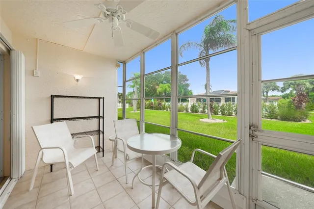 a room with furniture and a large window