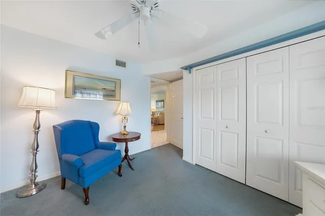 a living room with furniture and a lamp