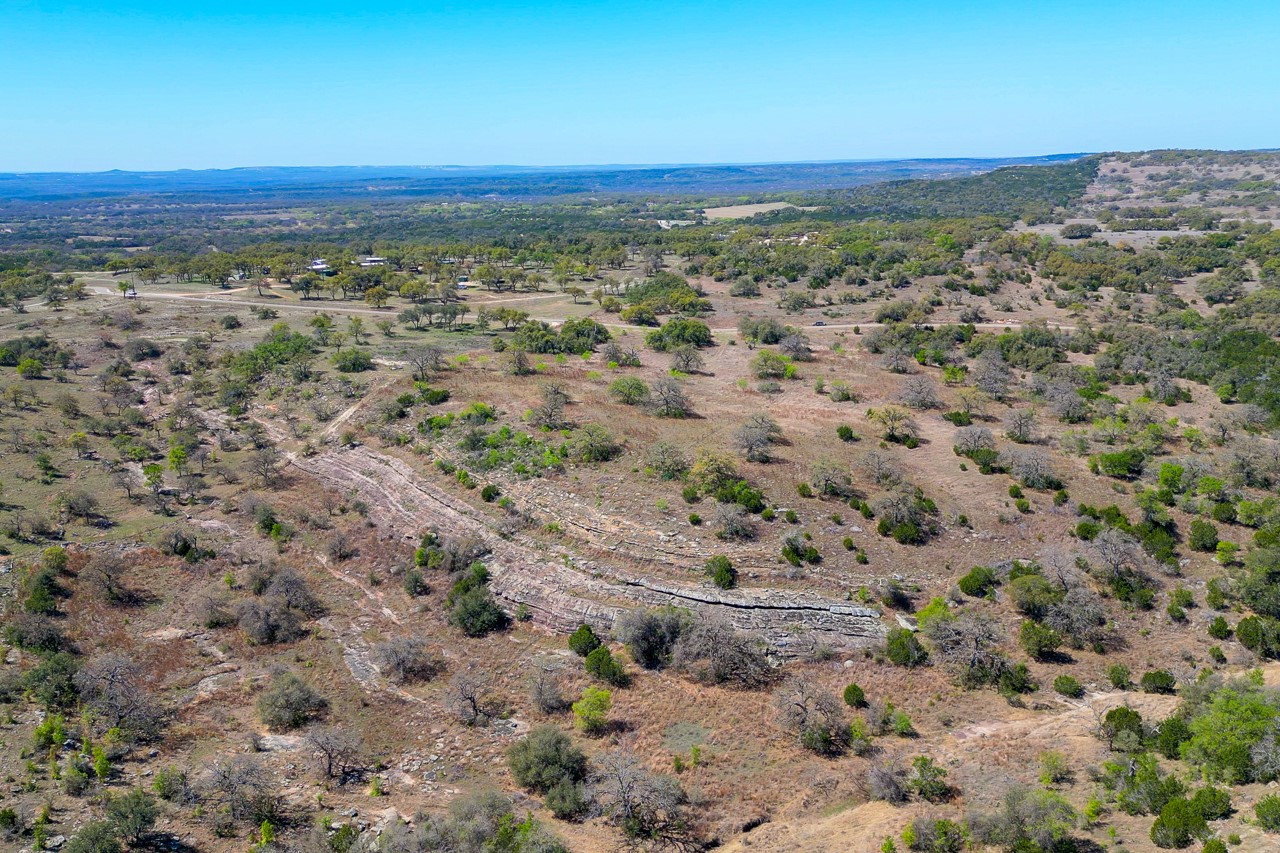 Tbd Tbd Smith West Road Johnson City, TX 78636 - Photo 4 of 36 Aerial view of sparsely populated area with a desert landscape