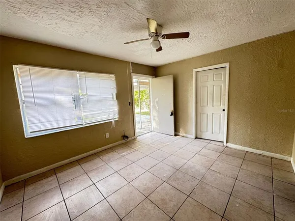 a view of an empty room with a window