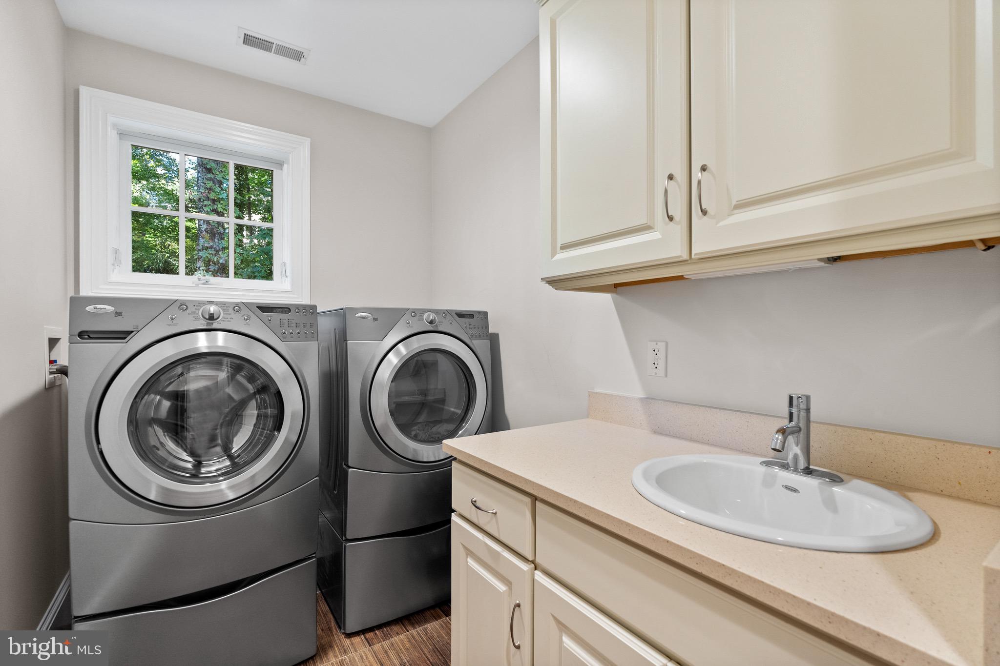 7500 Nevis Road Bethesda, MD 20817 - Photo 39 of 50 Laundry room with cabinet storage and sink