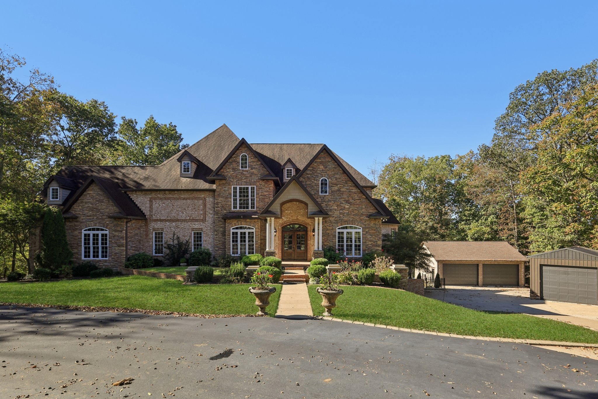 1556 A Berea Church Road Lebanon, TN 37087 - Photo 5 of 66 a front view of a house with a yard and garage