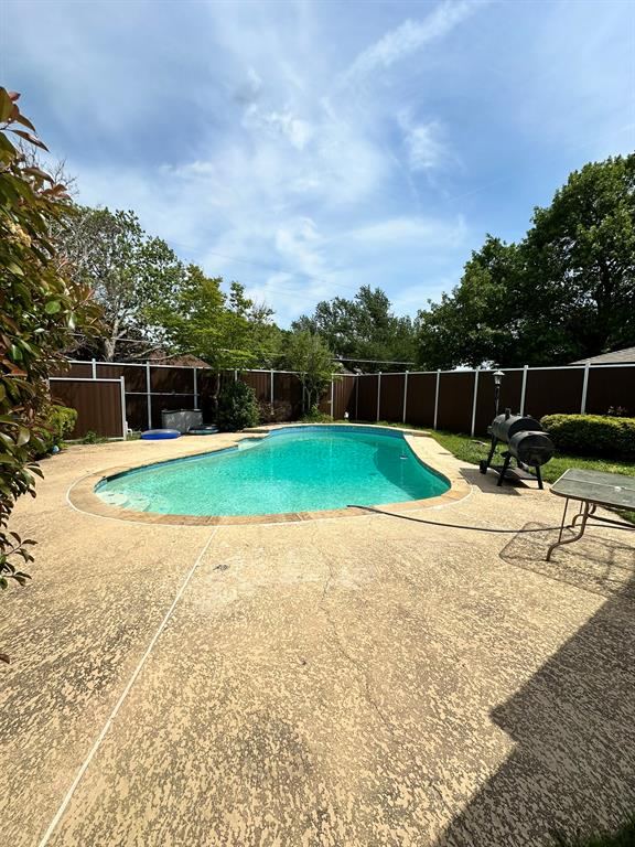502 Spring Willow Drive Allen, TX 75002 - Photo 18 of 28 a swimming pool with outdoor seating and yard