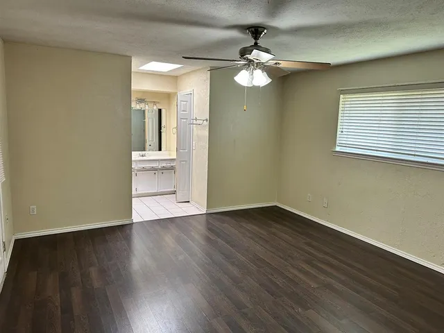 a view of a room with a wooden floor