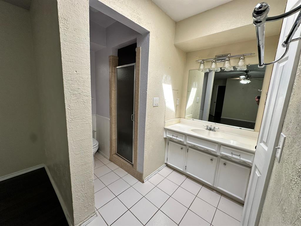 502 Spring Willow Drive Allen, TX 75002 - Photo 28 of 28 a view of bathroom with a sink and mirror