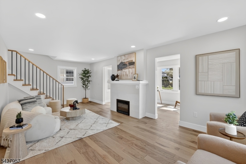909 Ridgewood Road Millburn, NJ 07041 - Photo 4 of 33 a living room with furniture and a fireplace
