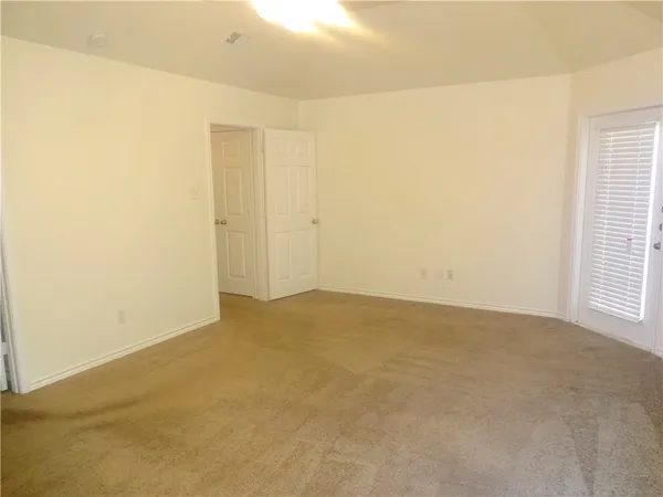 a bathroom with a double vanity sink a mirror and a bathtub